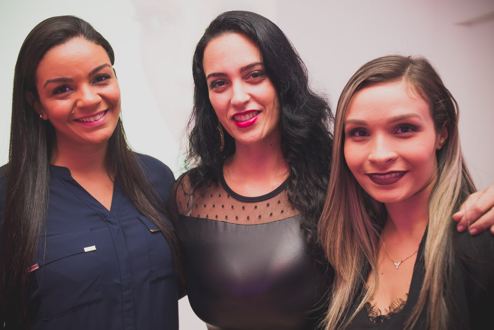 Image of three women at a corporate party taken with the Nikkor 35mm 2.0