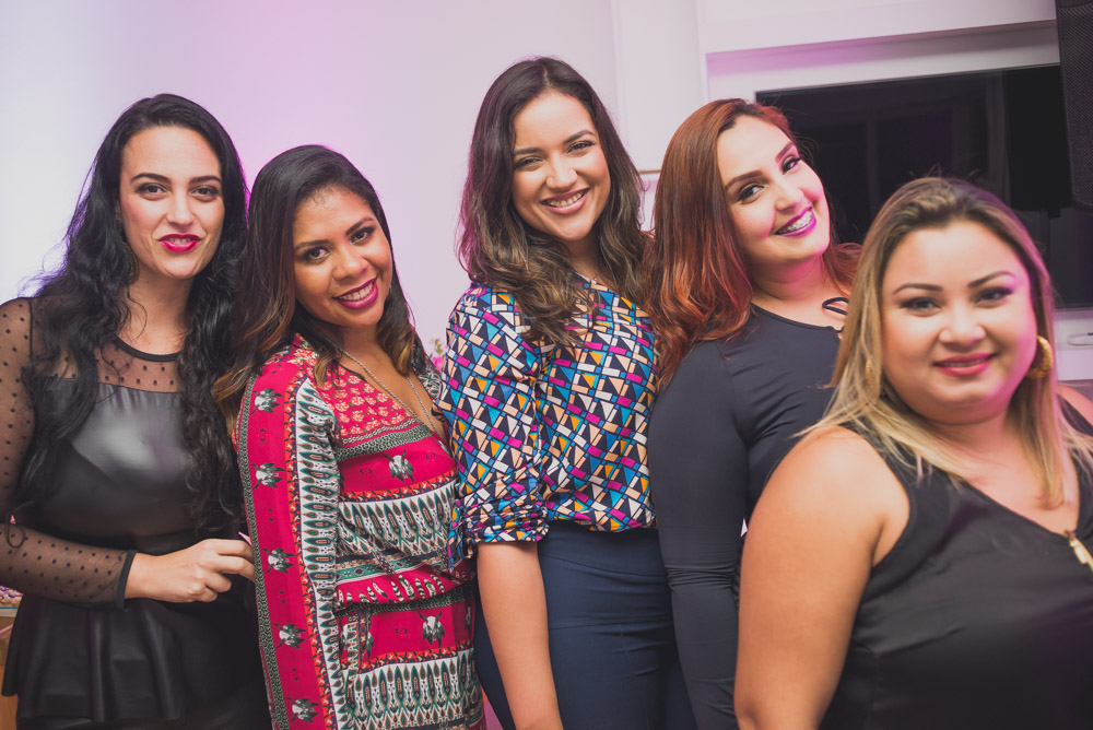Photograph of a group of smiling women at their corporate even