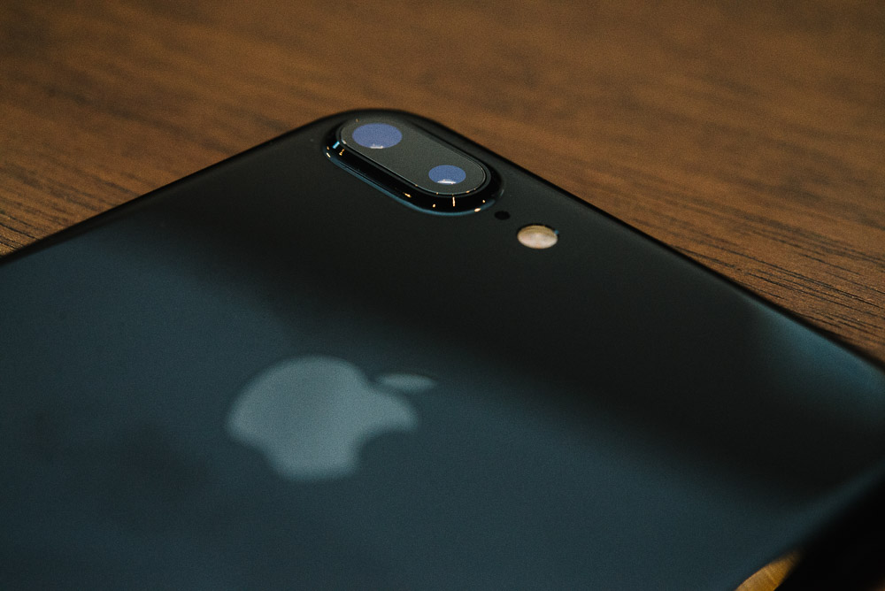 Image of the iPhone 7 Plus on a wooden table taken with flash