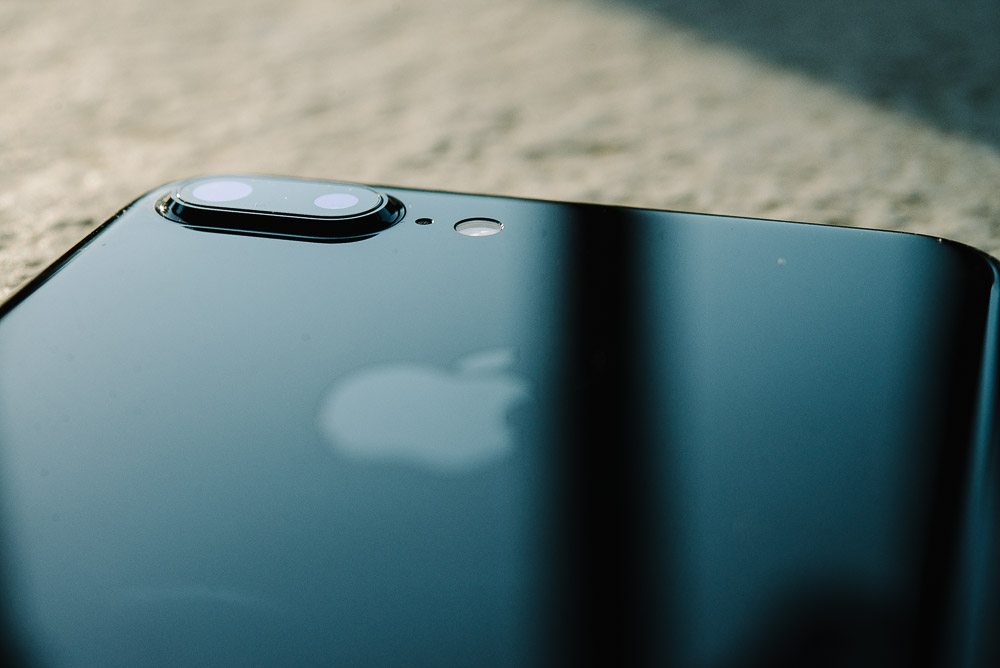 A black iPhone 7 Plus outside in natural light.