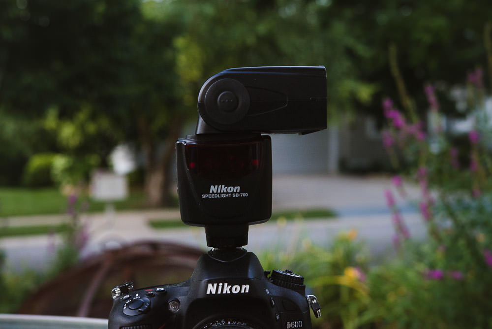 Photo of the Nikon SB 700 flash pointed to the side for bouncing off a wall