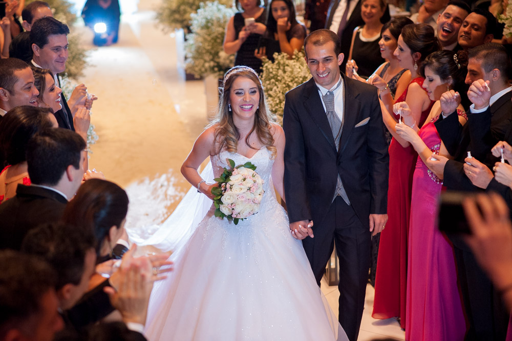 Wedding photography image of couple leaving their ceremony from an angle