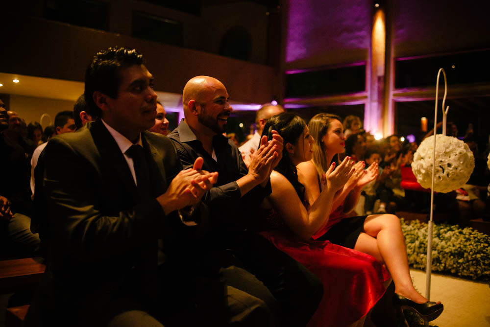 Image of a groom's best friend applauding during wedding ceremony