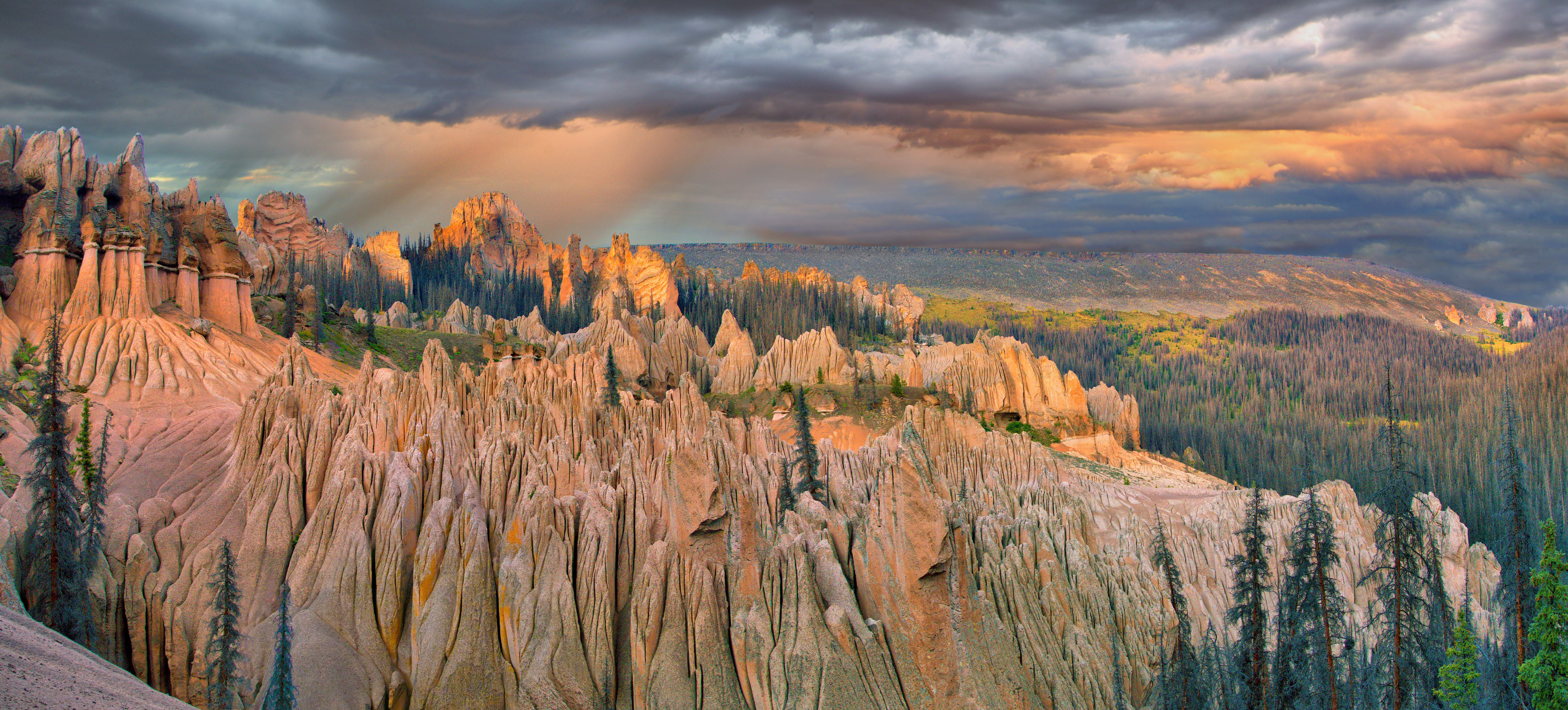 A landscape of a rocky canyon with warm light.