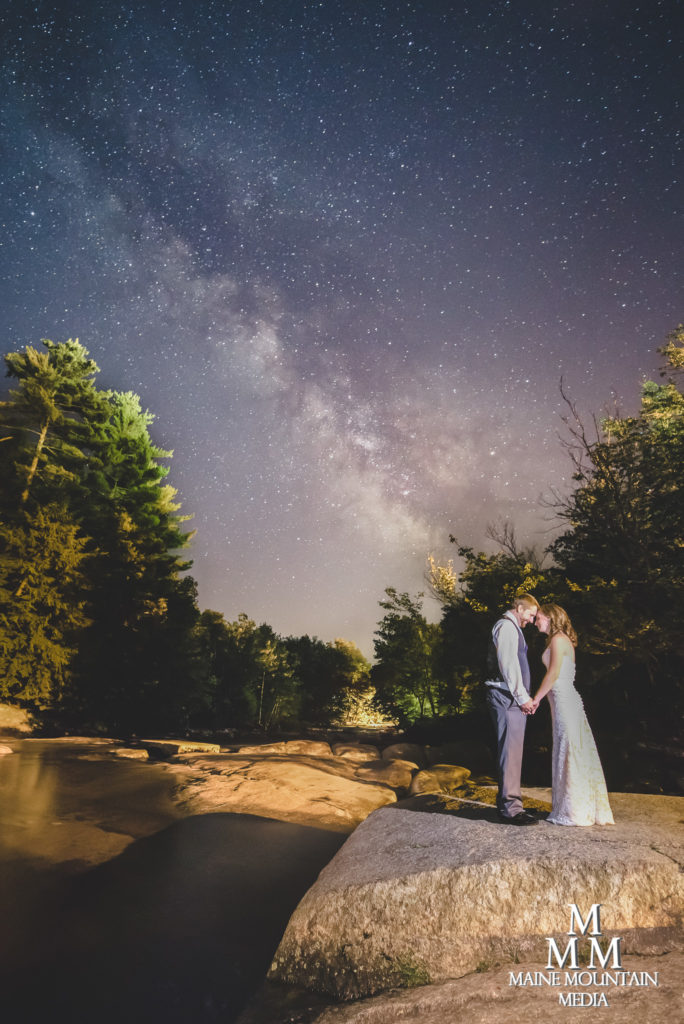 Photo by Paul Friedman of a couple on their wedding day in a long exposure with stars behind them