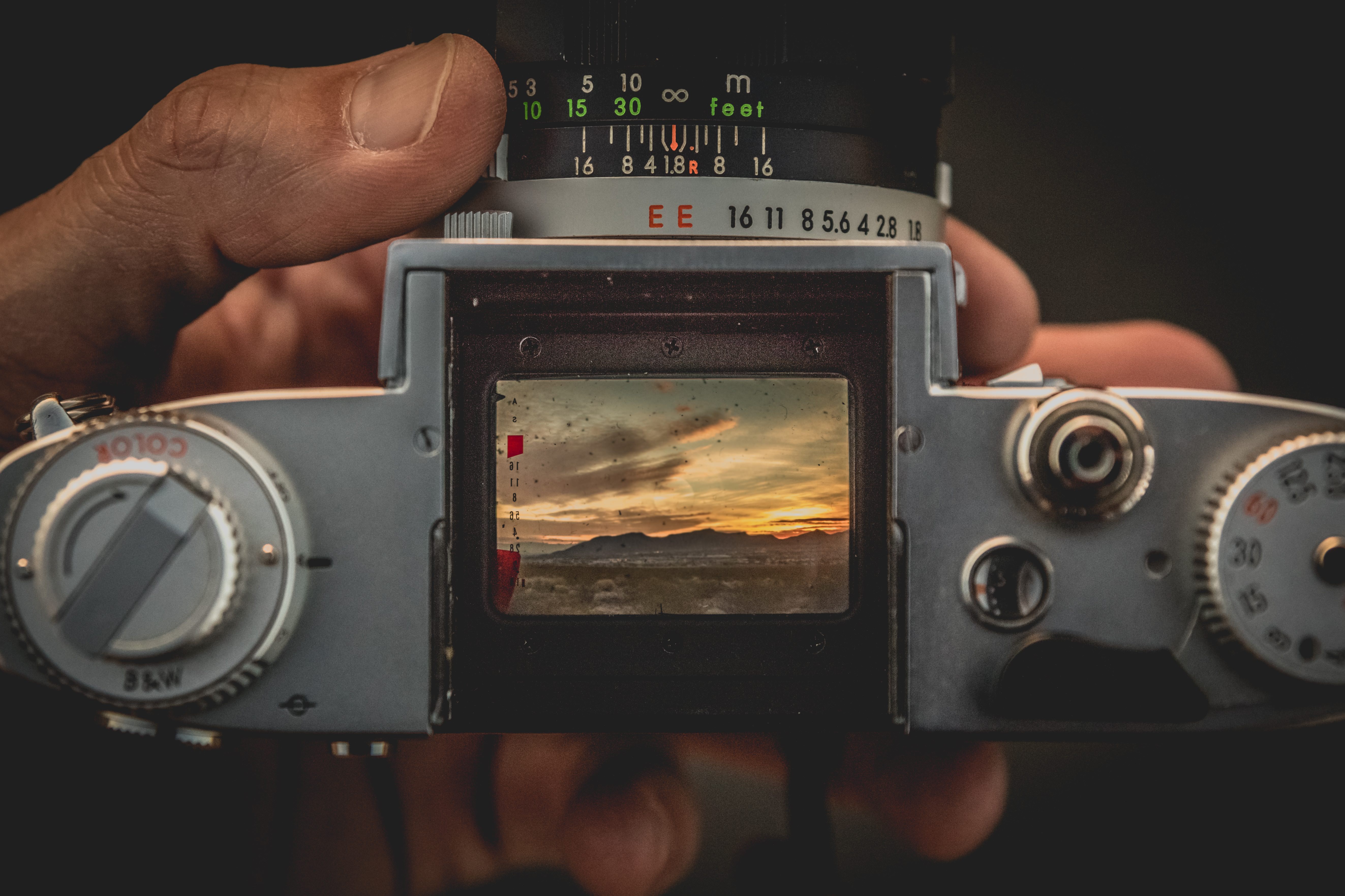 An old film camera with a waist-level viewfinder.