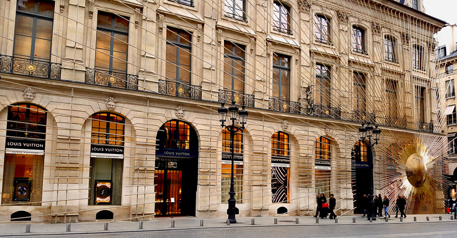 A Paris street with a gold installation.
