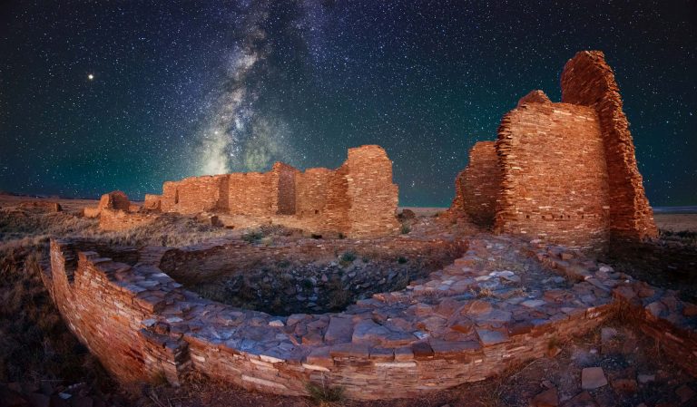 Stone ruins with the night sky and milky way in the background.