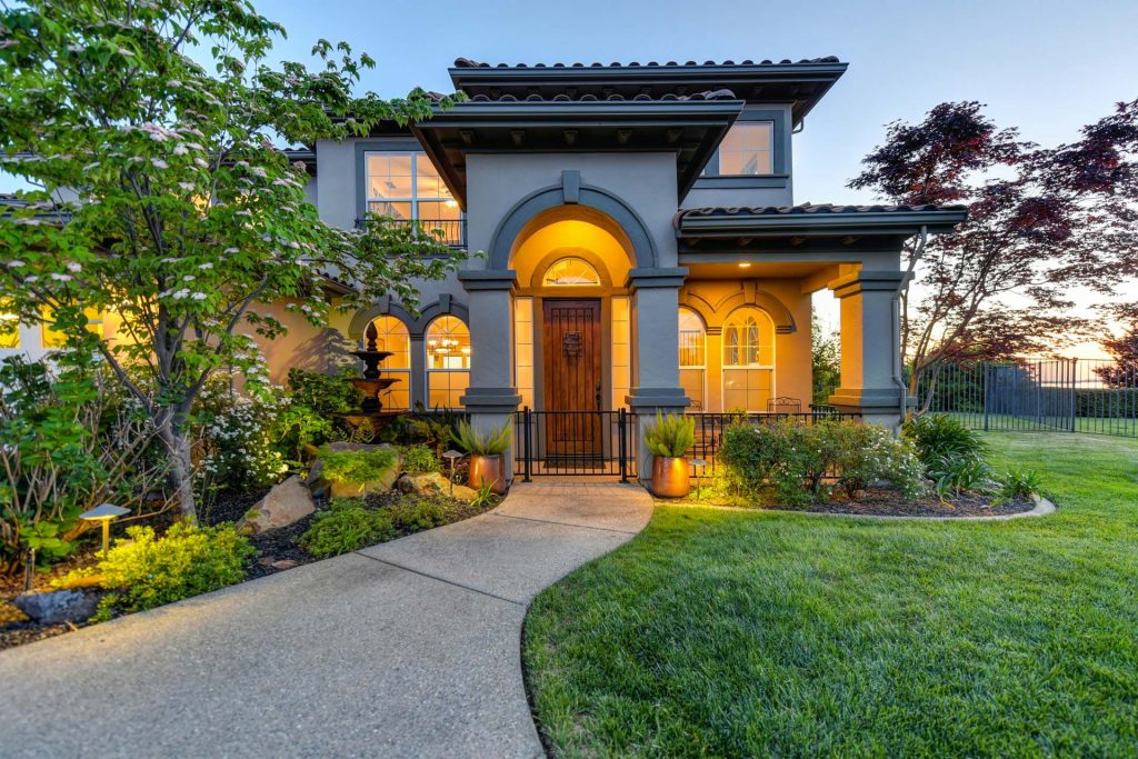 Real estate photo of a modern house on the market in the evening as the sun is going down