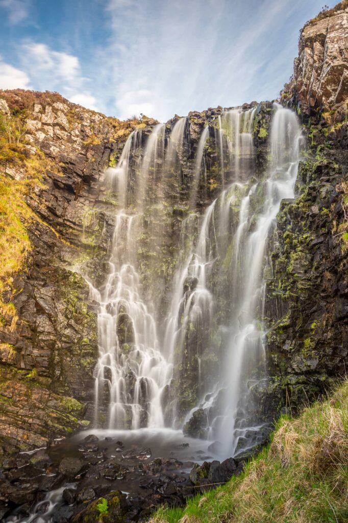 A waterfall on a sunny day.